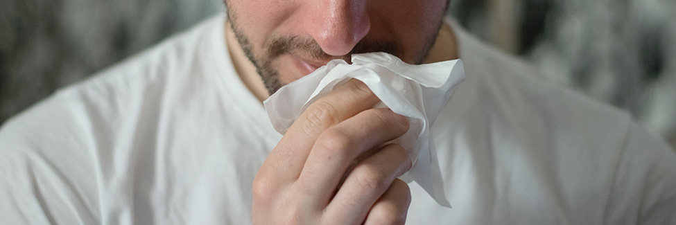 man with tissue